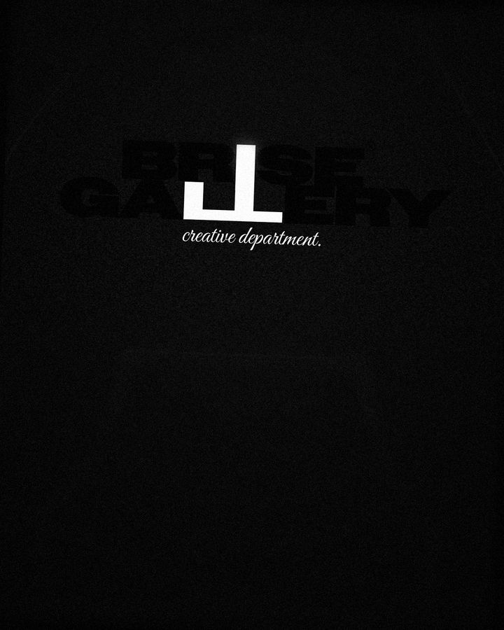 Hoodie front detail: BRISE GALLERY chest print, black on black with a white LL and the creative department script