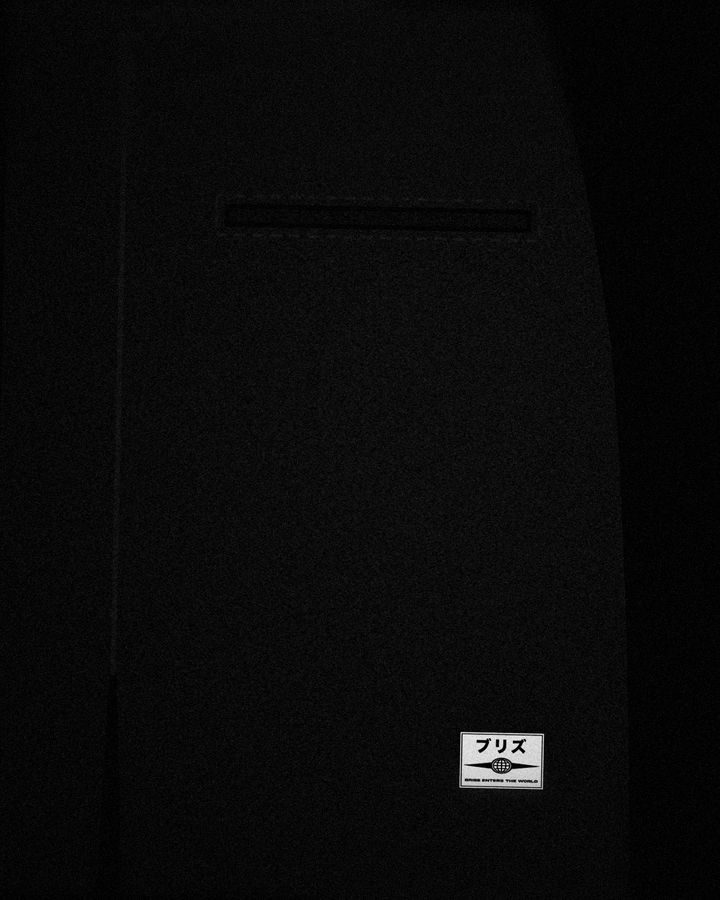 Pants back detail: slim welt pocket with the white patch below it on black fleece